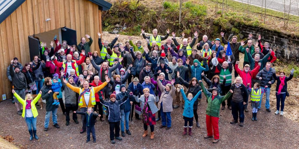 Community members celebrate the opening of BroomPower hydro