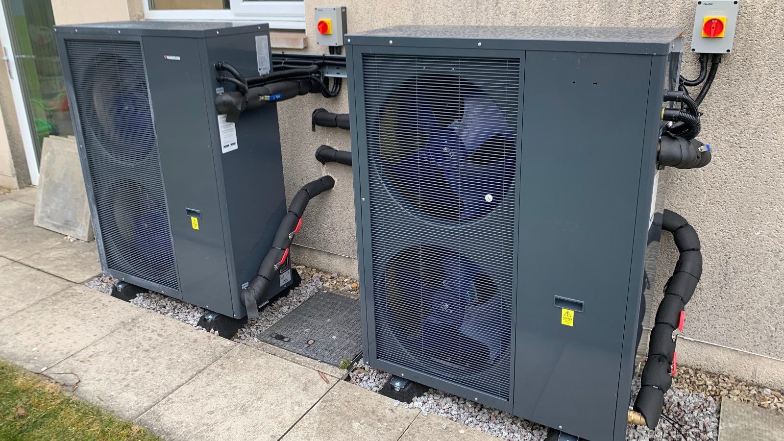 two air source heat pumps at ISKCON Scotland's community building complex